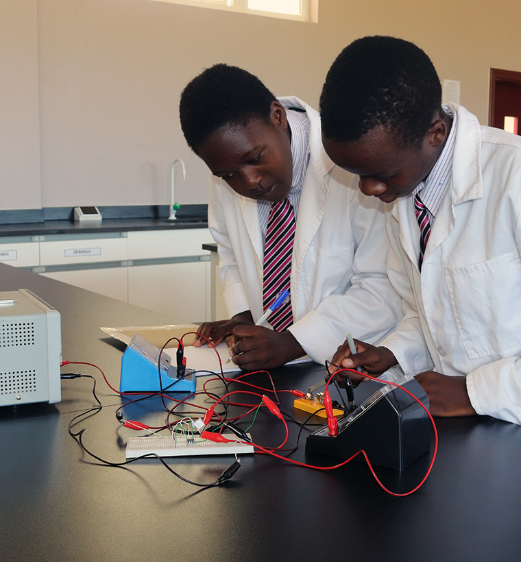 Learners conducting a practical science activity